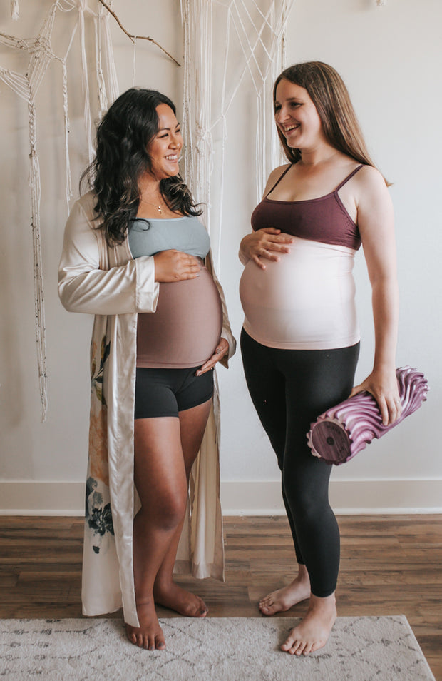 2 expecting mothers in yoga athleisure