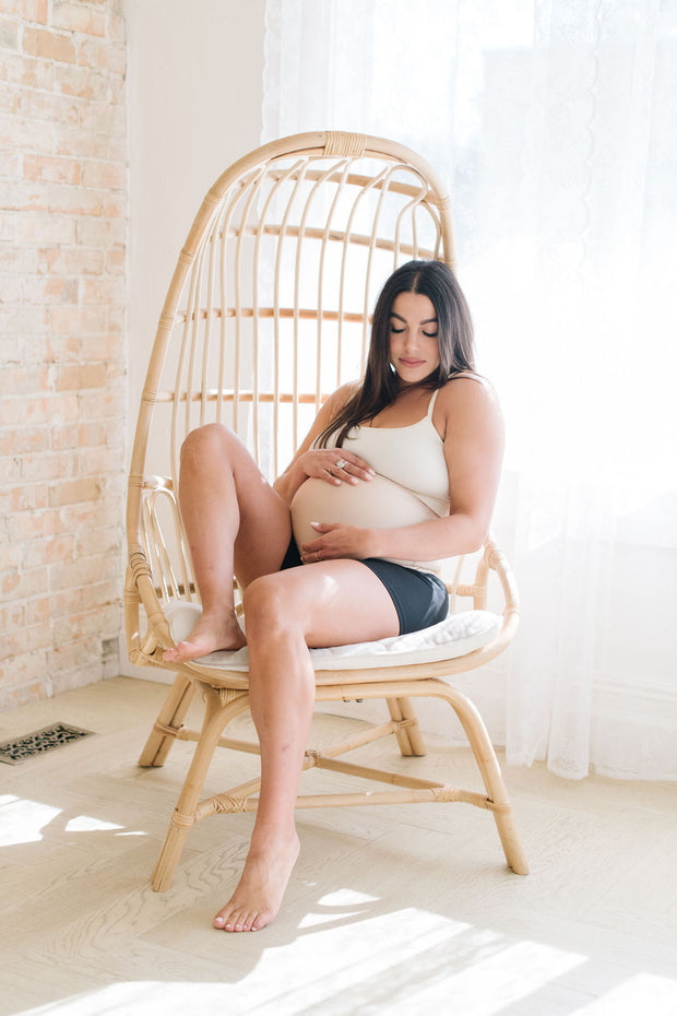pregnant woman sitting in chair